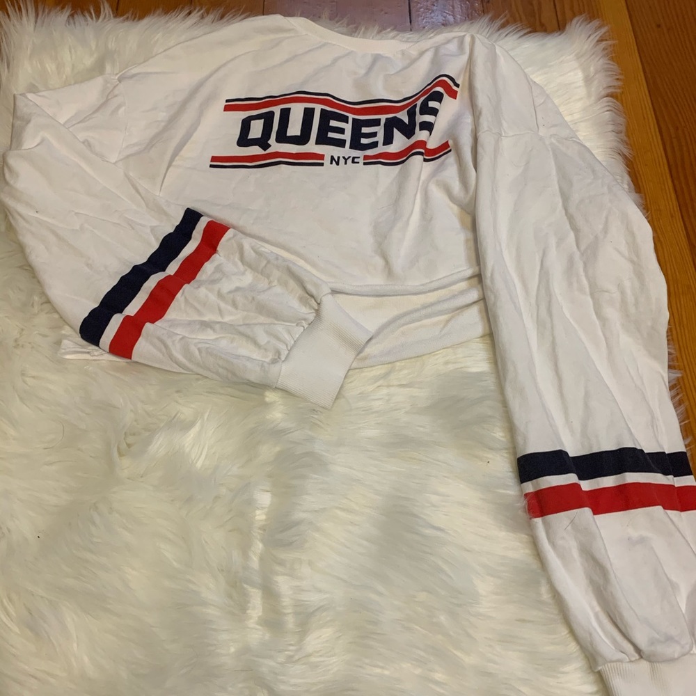 White Cropped Hoodie that says “ Queens NYC”